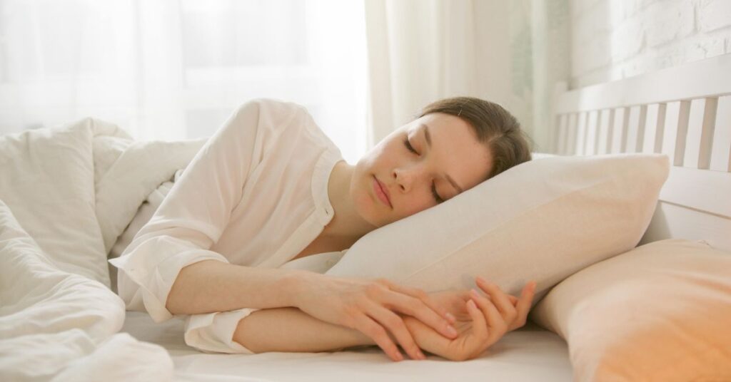 Exhausted person resting after workout showing the importance of recovery and rest days to avoid overtraining and injuries after 30