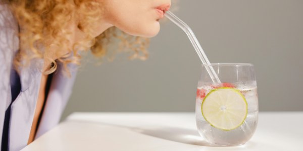 Woman over 30 drinking a healthy beverage to support fat loss and maintain facial health