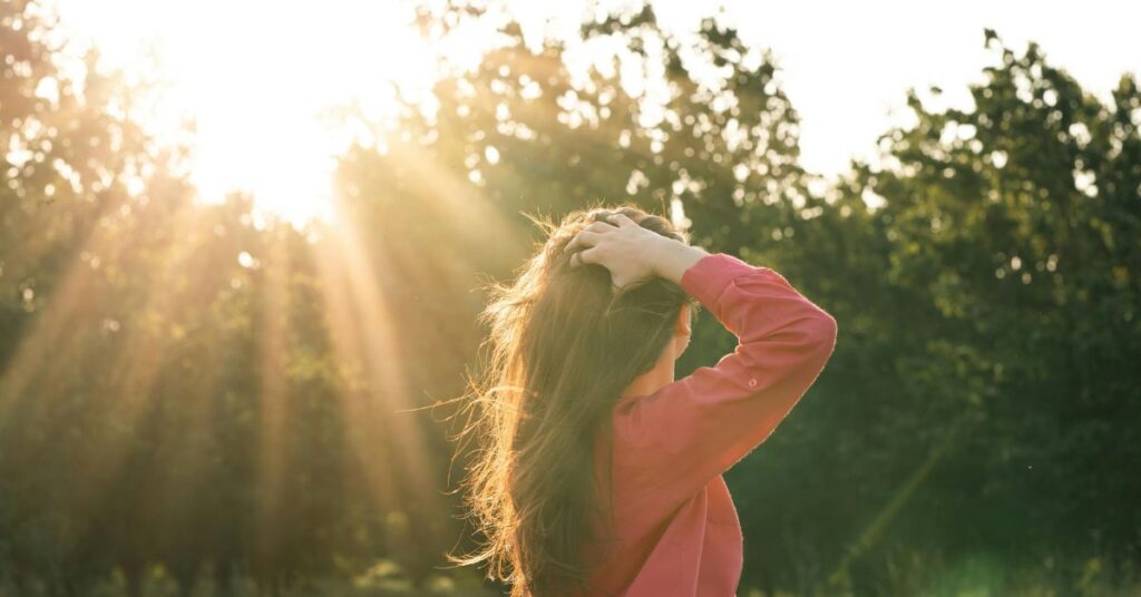 Woman with healthy shiny hair following polar hair care tips